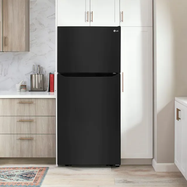 Black top freezer refrigerator in a kitchen