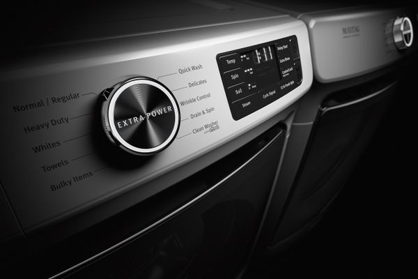 A close-up look at the Extra Power button on a Maytag front load washer