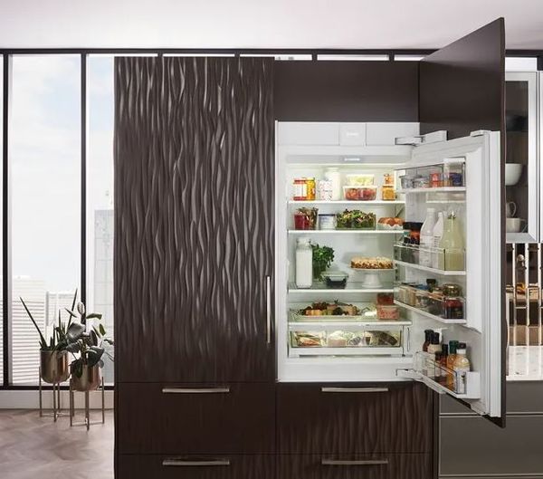 A Sub-Zero custom panel column refrigerator in a high-end kitchen