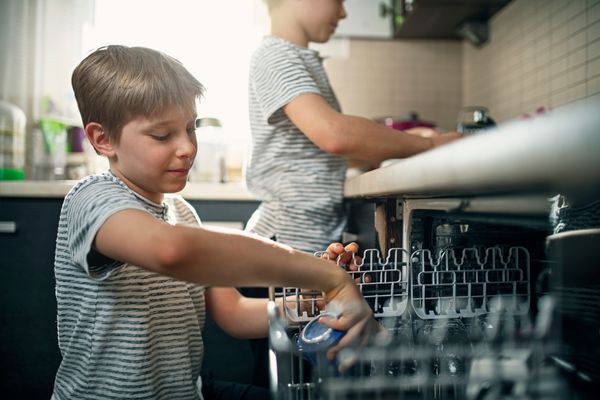 Siblings Loading a Dishwasher