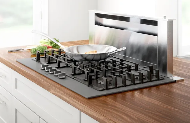 The Bosch Benchmark NGMP677UC 36” gas cooktop with a saute pan 