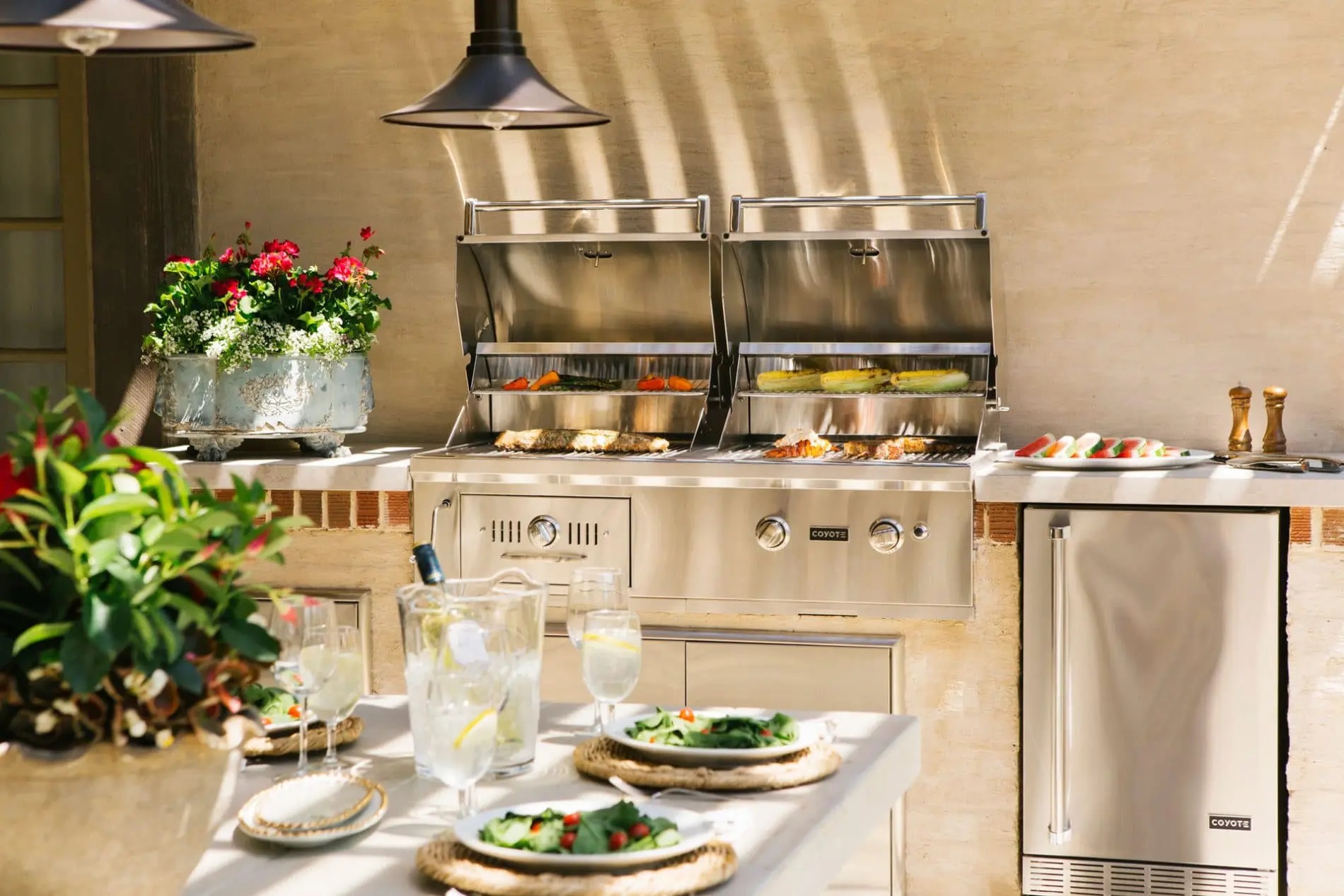 A Coyote built-in gas grill featured in an outdoor kitchen 