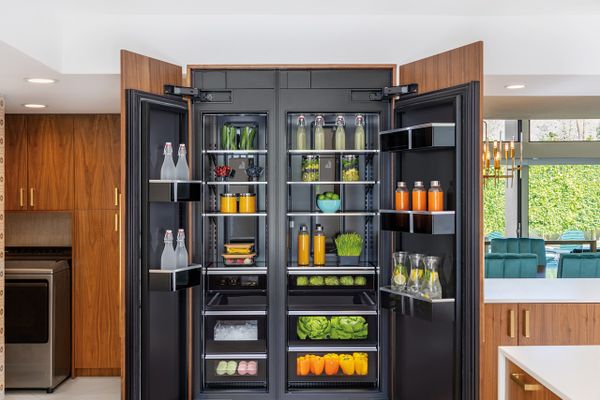 A JennAir refrigerator with its doors open showcasing the Obsidian interior
