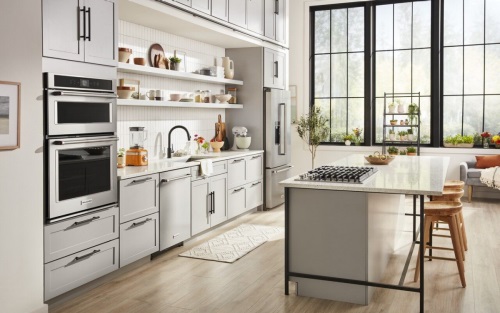 Wide view of a gourmet kitchen featuring KitchenAid appliances