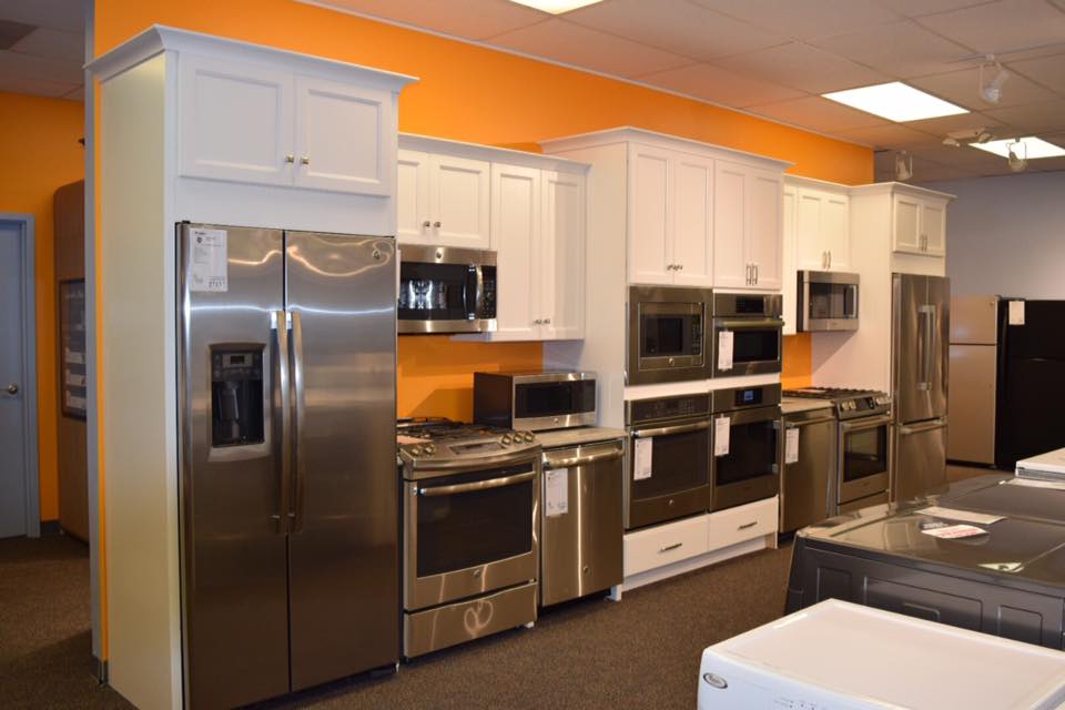Several kitchen and laundry appliances inside a Don’s Appliances showroom 