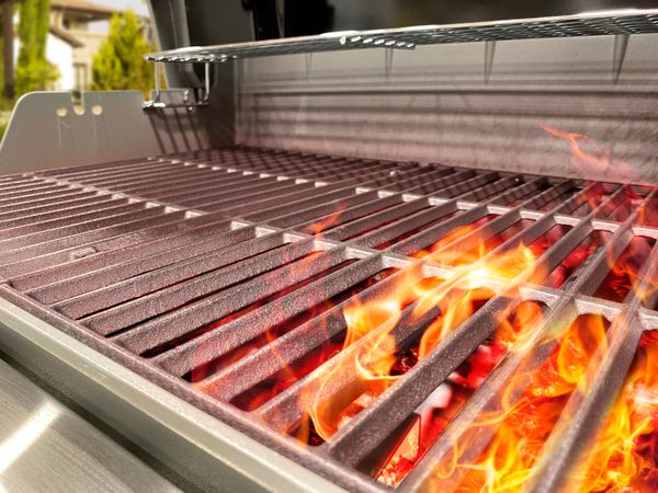 A close-up of flames on a gas grill 