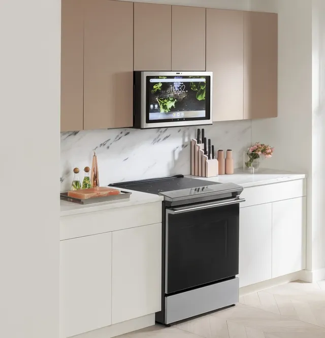 The Café CHS90XM2NS5 induction range shown with a Café over-the-range microwave 