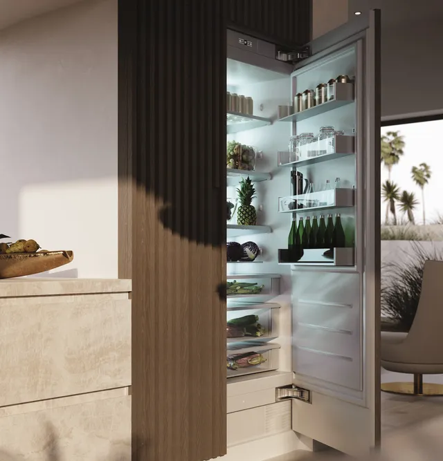 The Monogram ZIR241NPNII column refrigerator with its door open and stocked with food 