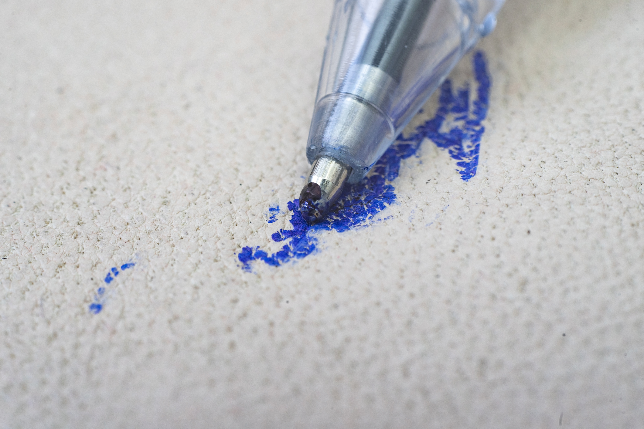 A close up of a blue ink pen