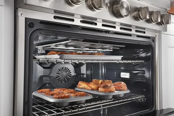 Pastries baking inside the KitchenAid KFDC506JSS dual fuel range 