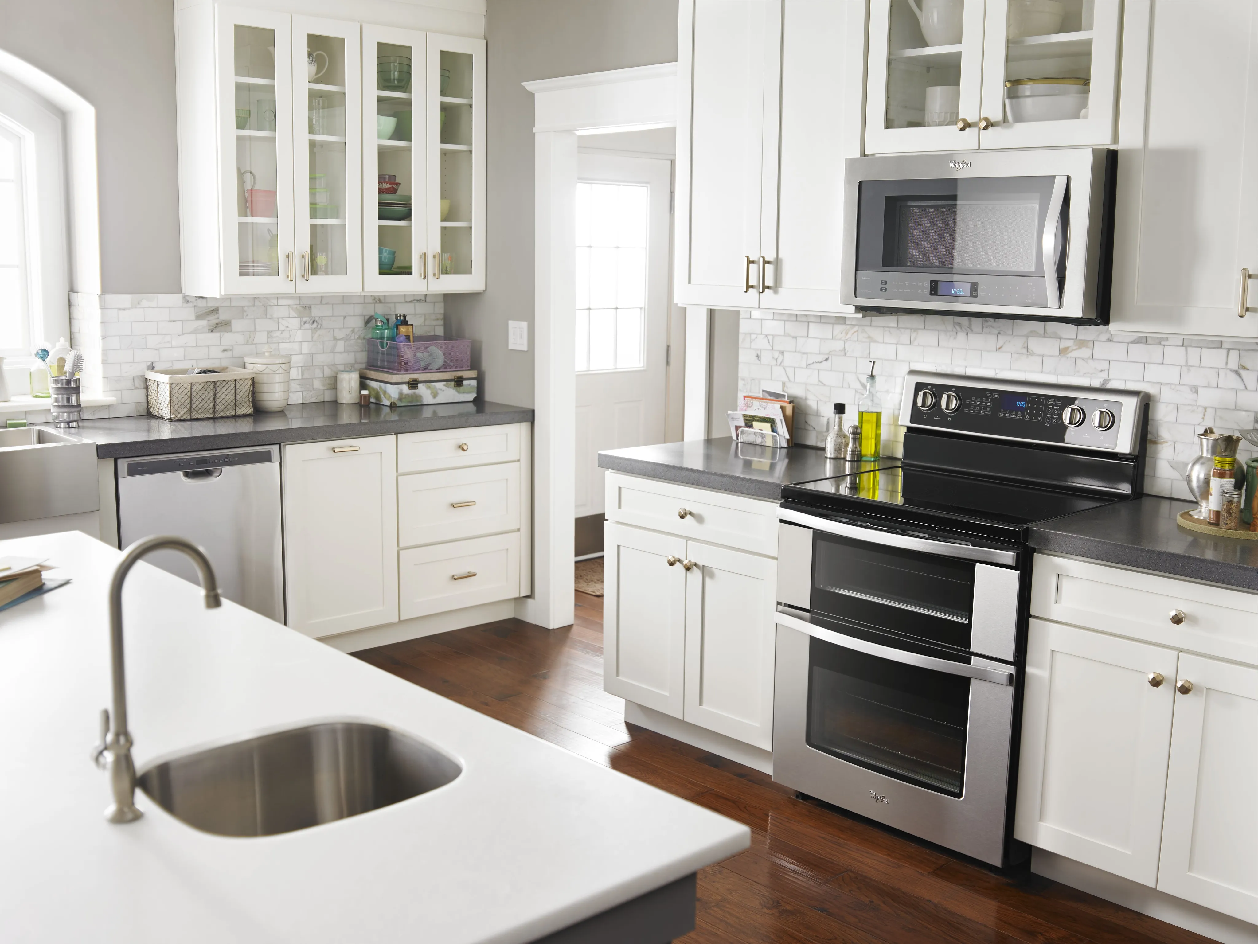 A Whirlpool WGE745C0FS 30” electric double oven range shown in a kitchen 