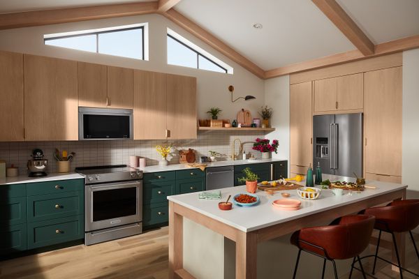 A kitchen featuring the KitchenAid KMMF530PPS over the range microwave