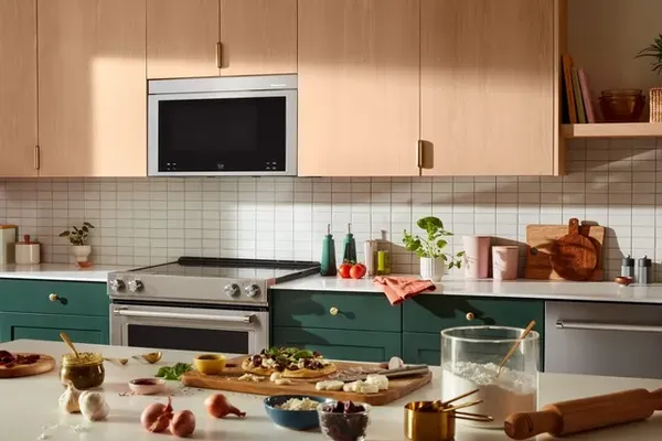 A kitchen featuring the KitchenAid KMMF530PPS over the range microwave