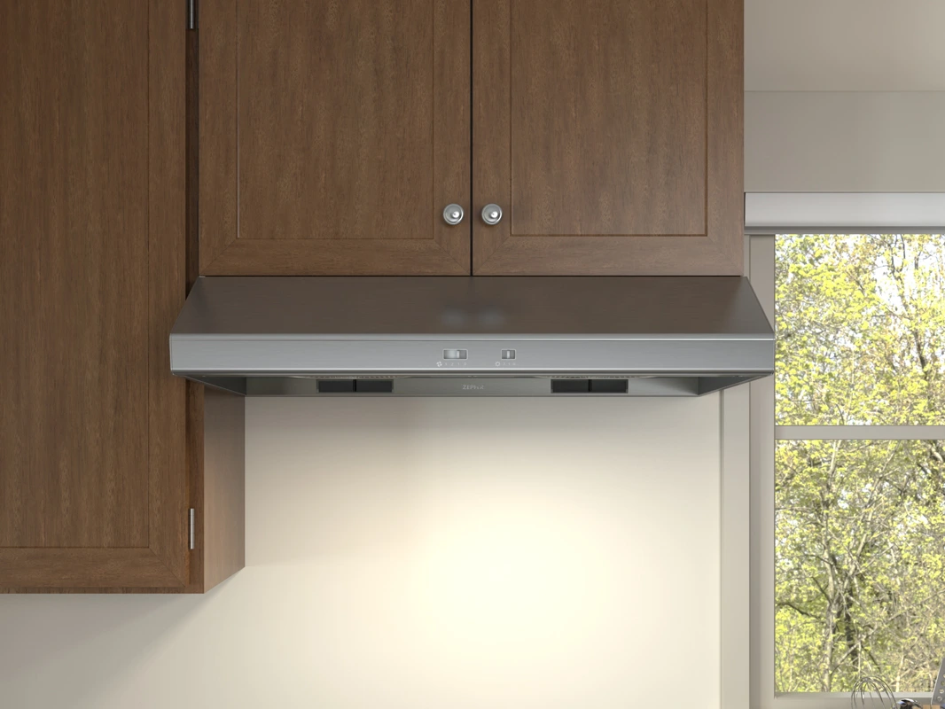 The Zephyr AK6500CS under cabinet range hood installed under wooden cabinets 