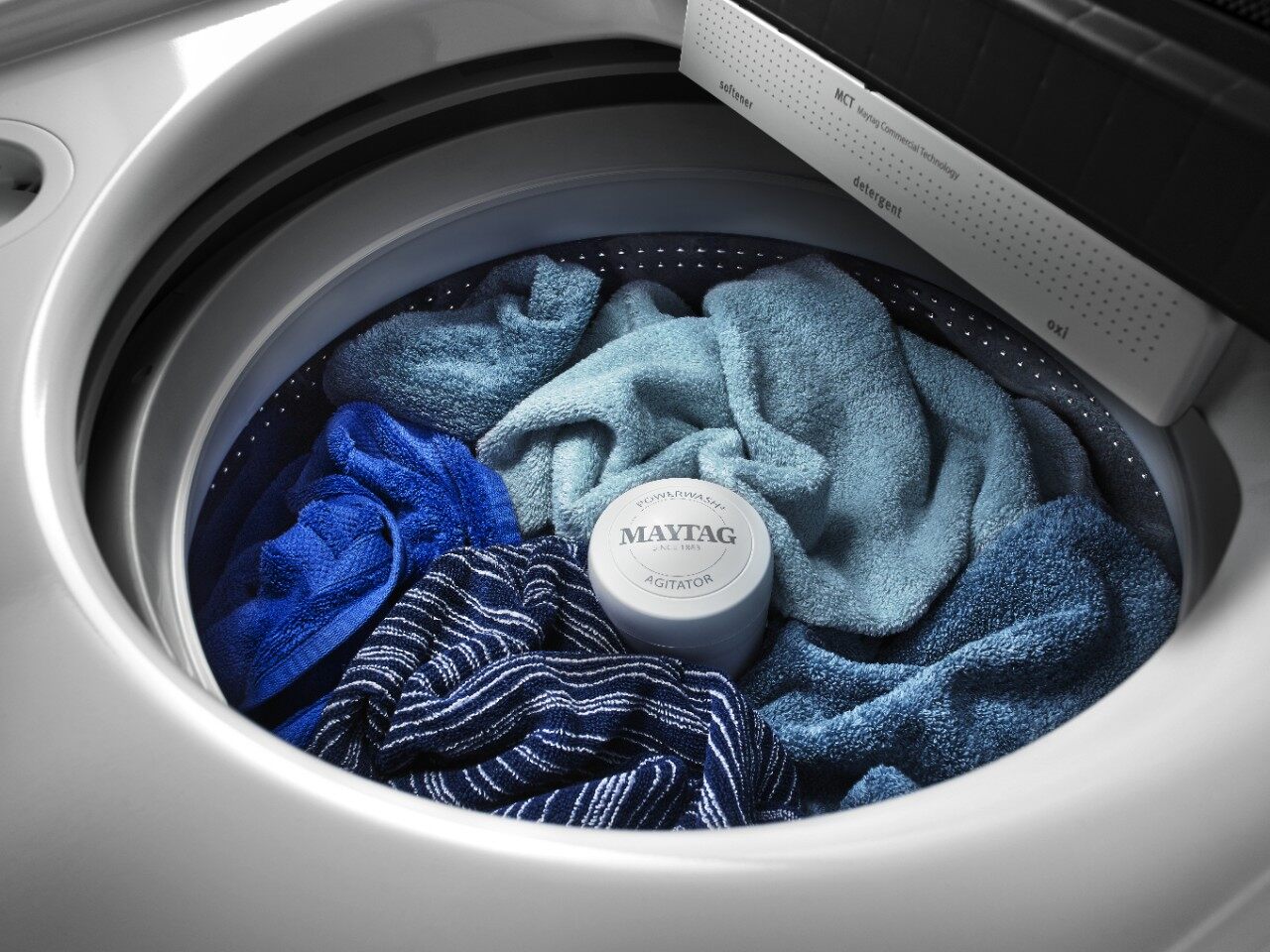 Overhead look inside the Maytag mvwb766fw top load washer washing a load of laundry 