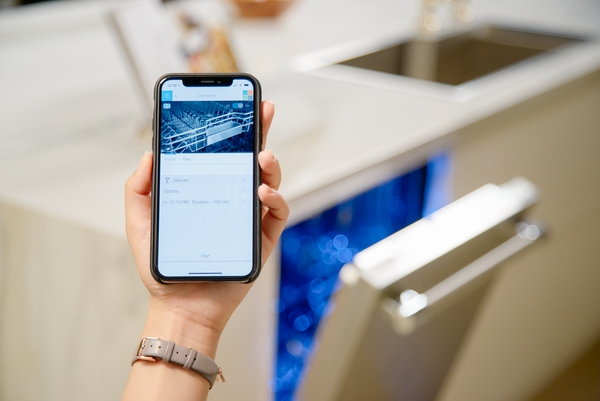 A person using the Home Connect app on a Thermador dishwasher 