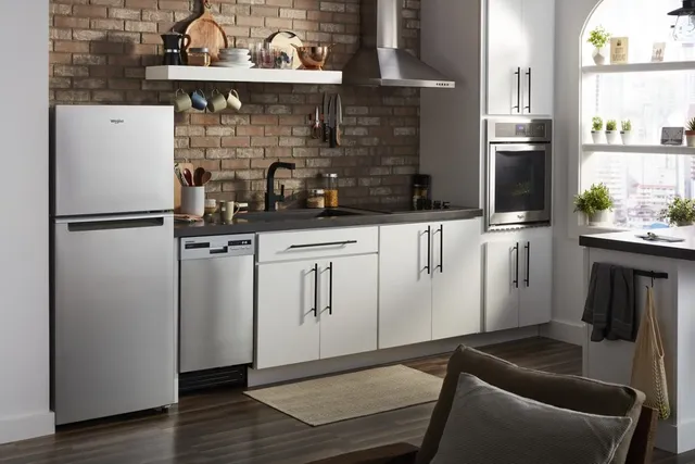 The Whirlpool WRT112CZJZ top freezer refrigerator in a kitchen 