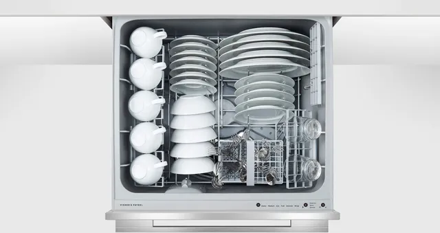 Overhead view of the Fisher & Paykel Series 9 DD24DDFTX9 N dishwasher full of dishes 