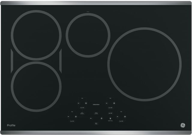 Stock photo of a black GE Profile brand induction cooktop with four burners.