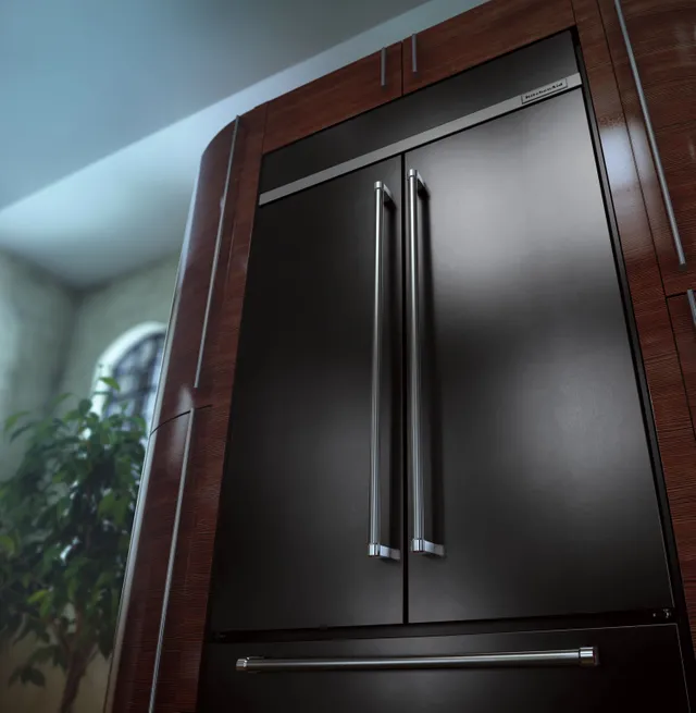 A closeup shot of the KitchenAid KBFN502EBS built in black stainless steel refrigerator 