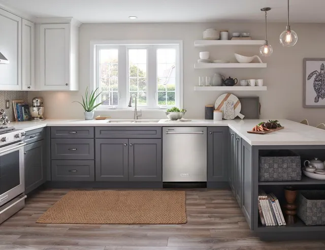 The KitchenAid KDTM404KPS dishwasher featured in a kitchen 