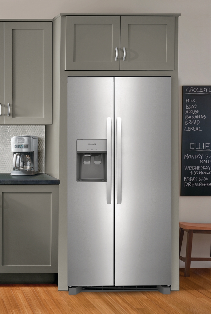 Frigidaire FRSS2323AS stainless steel side by side refrigerator in contemporary kitchen