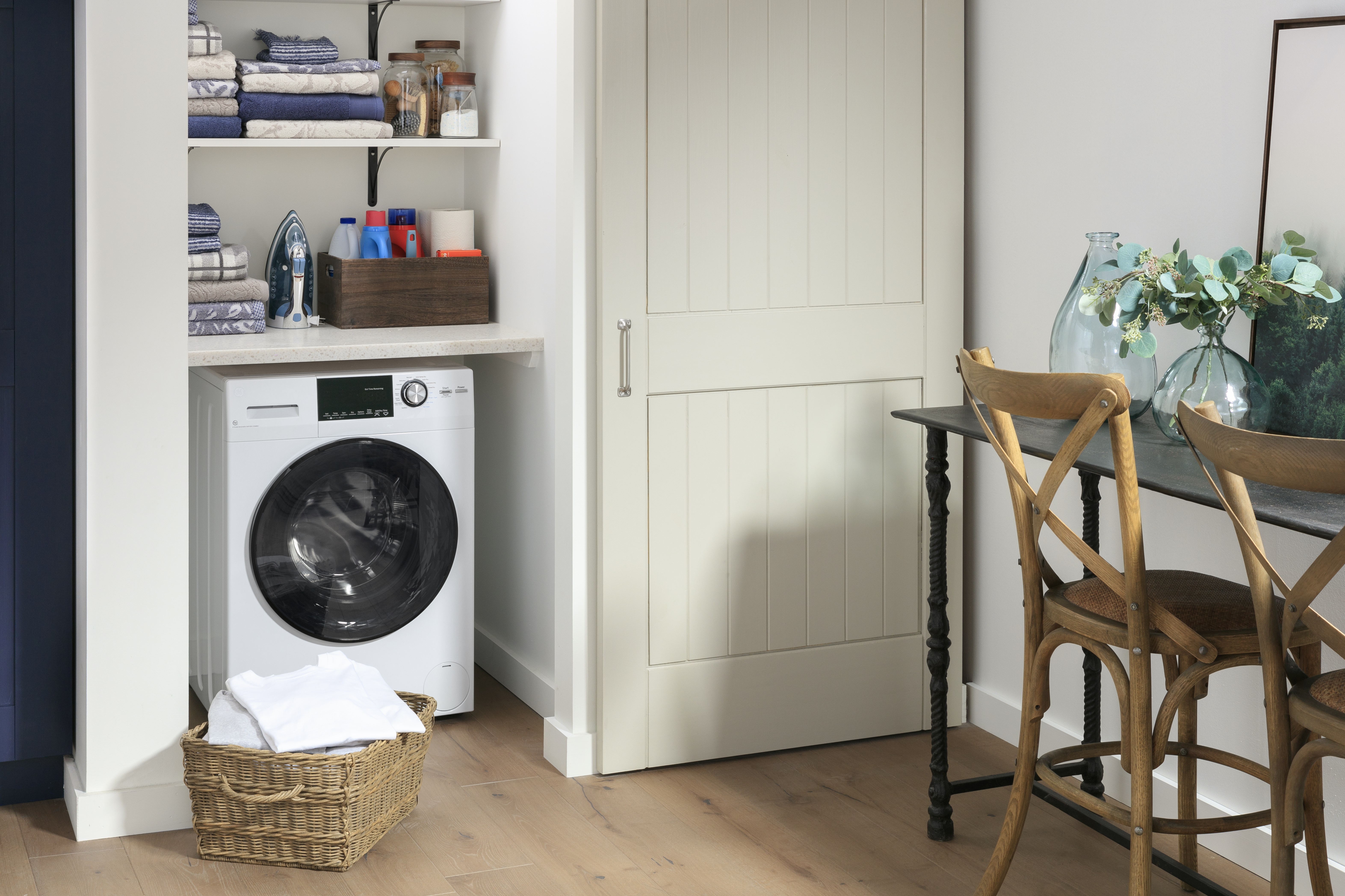 GE gfq14essnww washer dryer combo in white installed in a closet