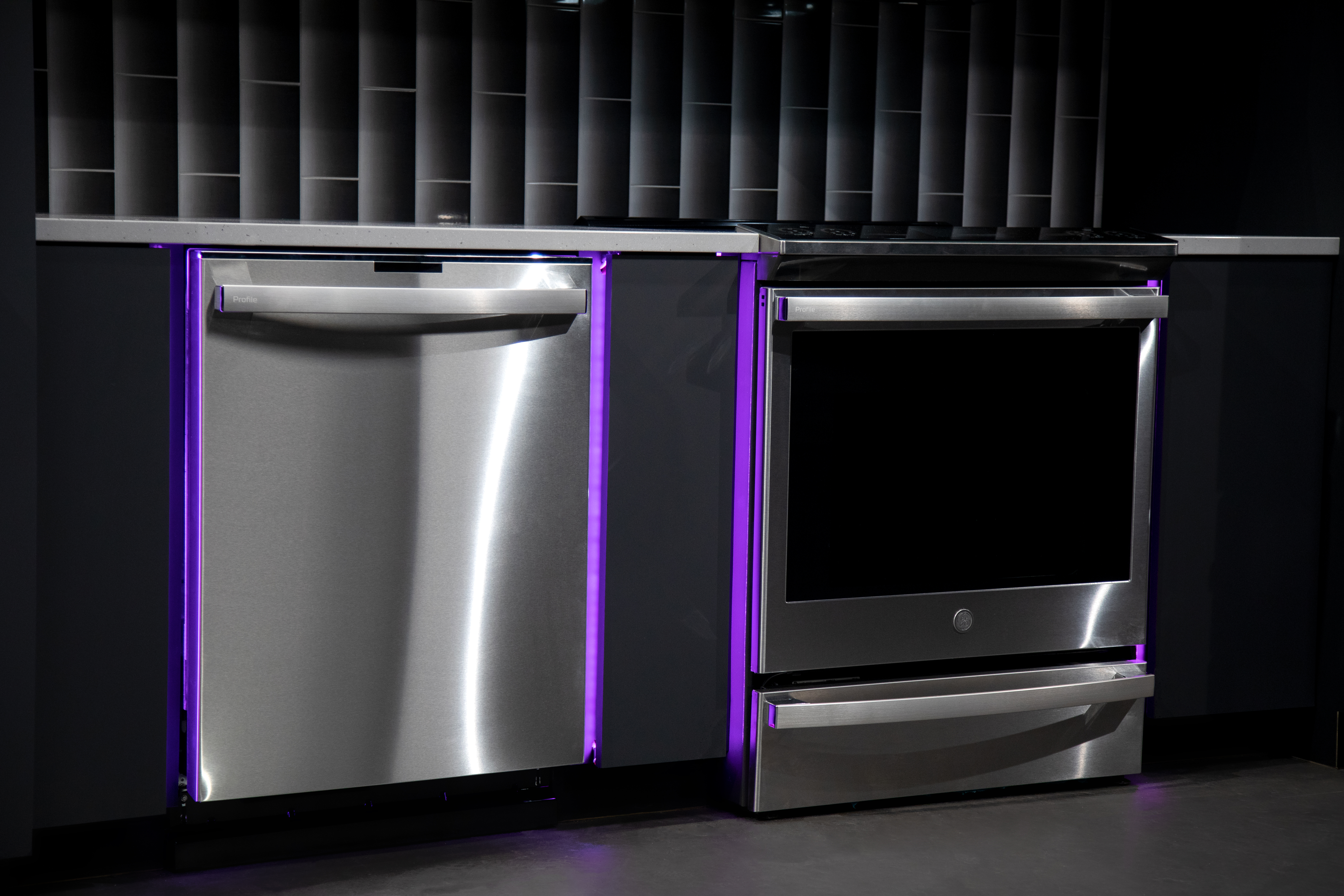 A GE Profile dishwasher with a matching GE Profile slide-in range 