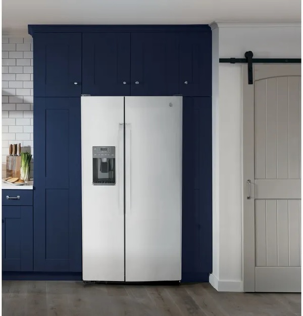 The GE GSS25GYPFS side by side refrigerator in a navy-themed kitchen 