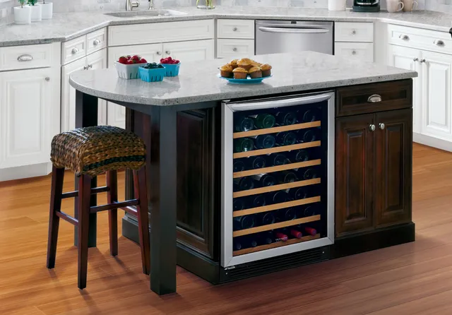 The Frigidaire FGWC5233TS wine cooler installed under a granite top kitchen island 