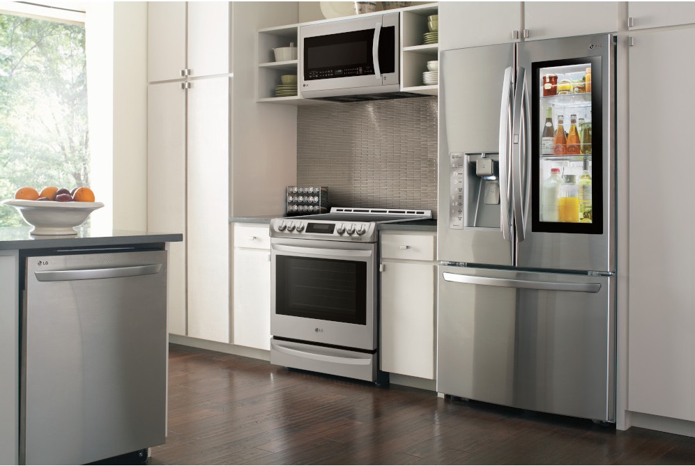 A kitchen featuring an LG refrigerator, range, dishwasher, and microwave 