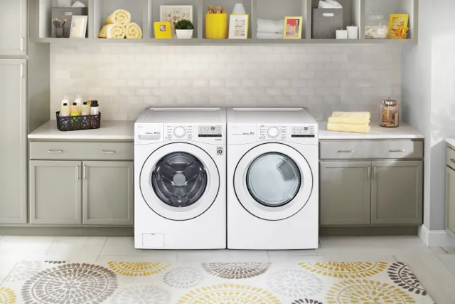 The LG WM3400CW front load washer and LG DLG3401W gas dryer in a laundry room 