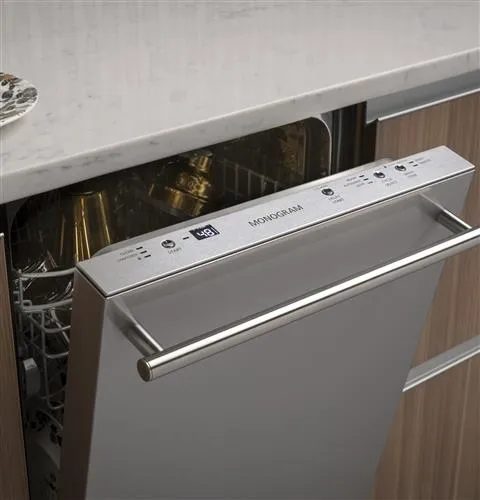 An up close of the Monogram ZDT165SILII dishwasher with its door open 