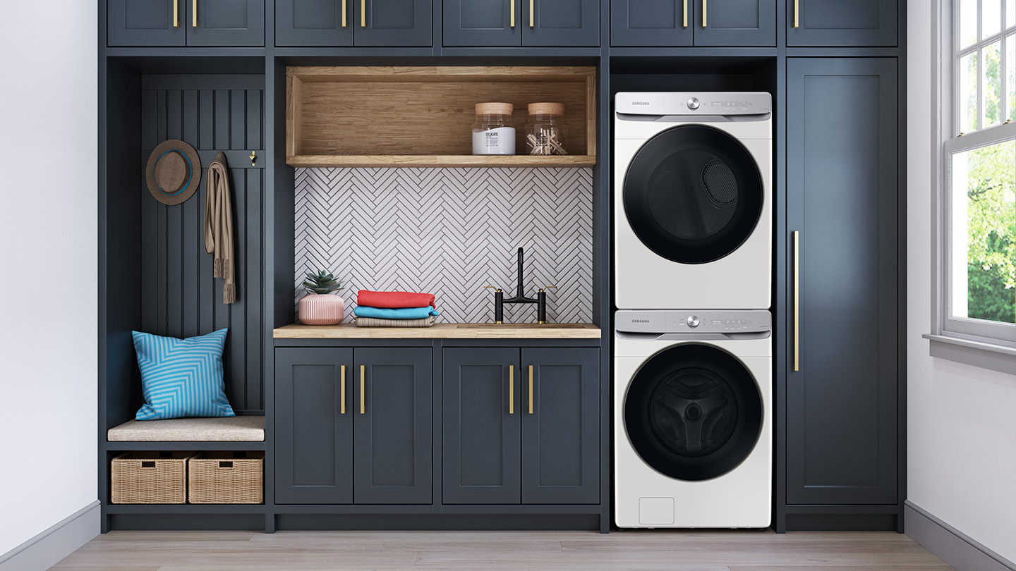 Wide shot of Samsung front load washer and dryer stacked in a laundry room 