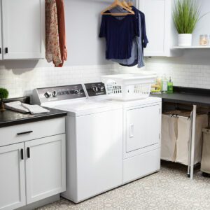 The Speed Queen TR5 washer with matching dryer in a laundry room 