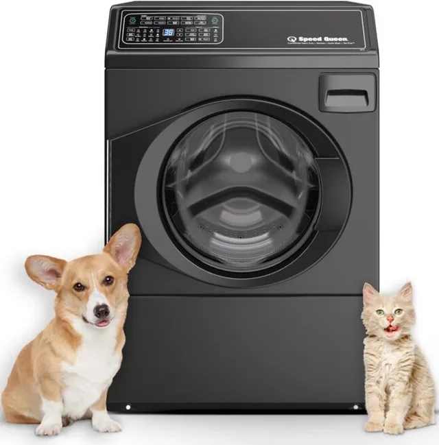 A dog and a cat in front of a Speed Queen black FF7 front load washer 
