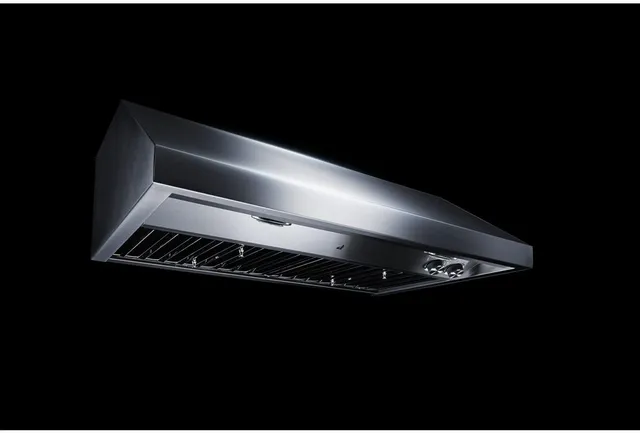 The JennAir JXU9136HP under cabinet hood shown against a black background 