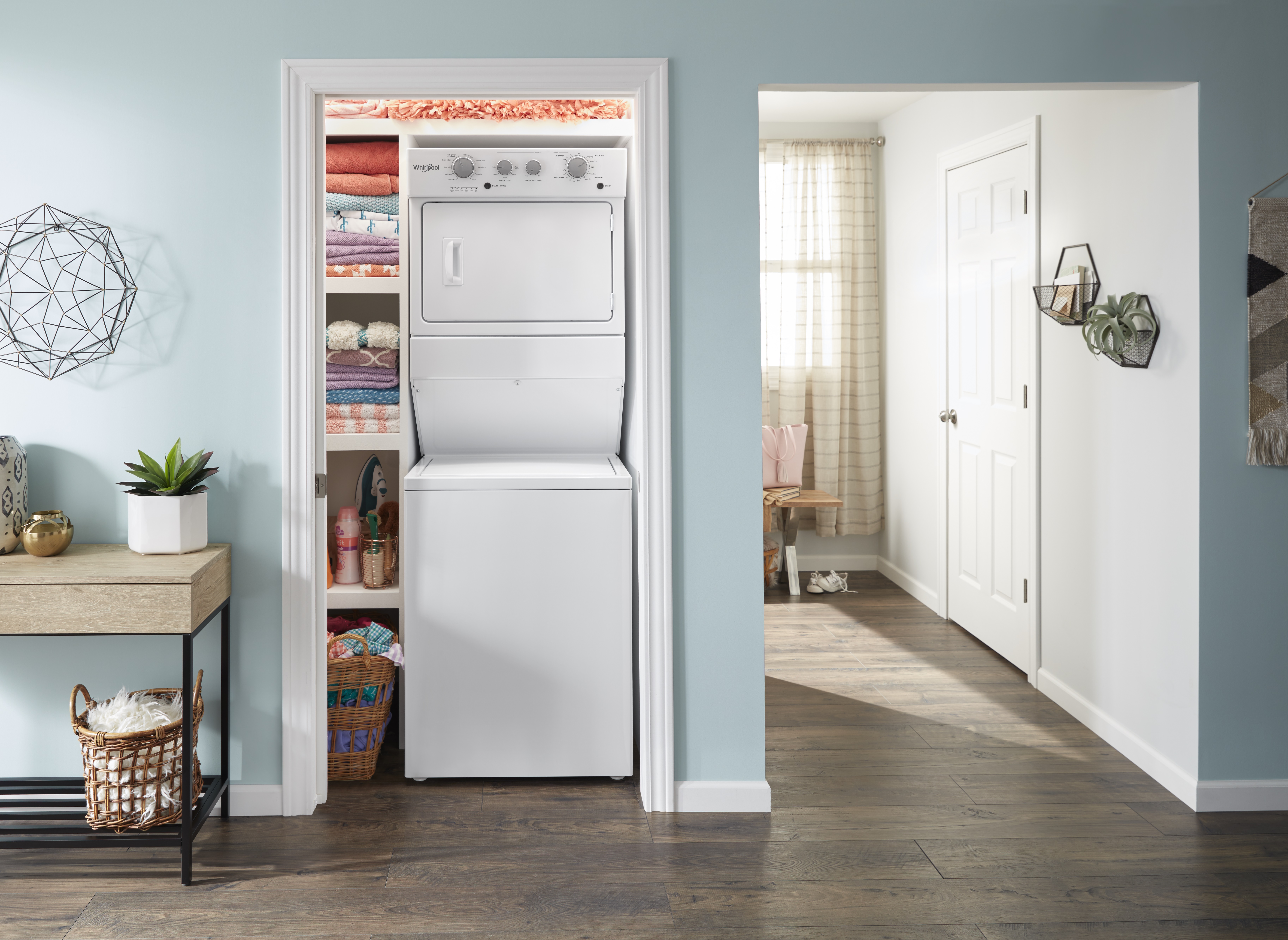 Lifestyle image of Whirlpool WET4027HW stacked washer dryer unit