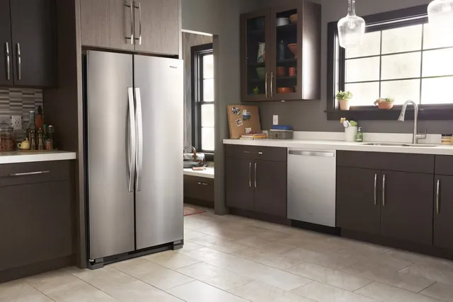 The Whirlpool WRS315SNHM side by side refrigerator in a modern kitchen 
