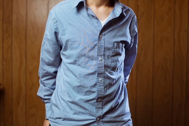 iStock Credit: timnewman Shot of person in wrinkled blue pinstripe button up shirt