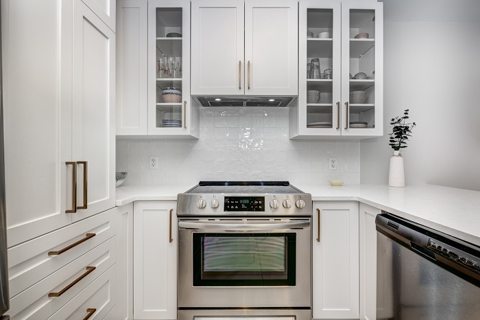 Full set of small modern luxury kitchen appliances in a well organzied apartment.