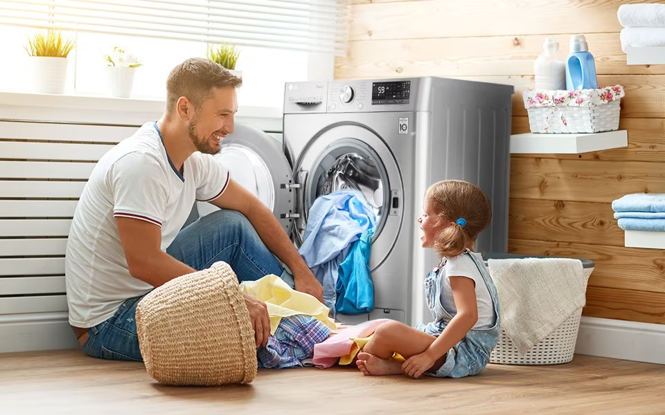 Father and Daughter in Front of LG Washer
