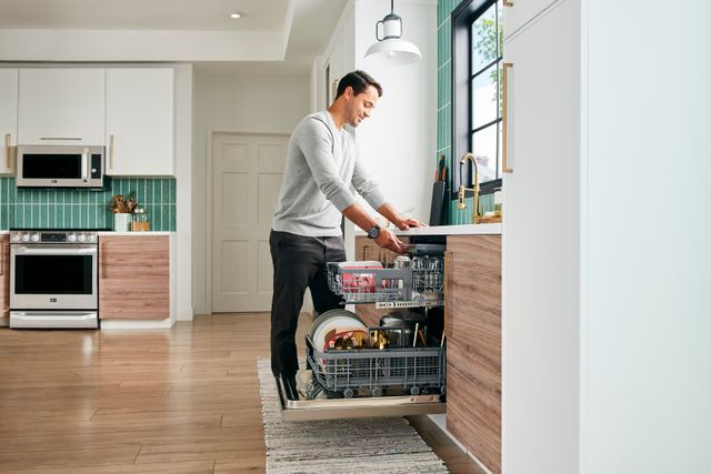 Man Loading a Dishwasher