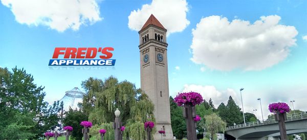 Image of a clock tower with the Fred’s Appliance logo 