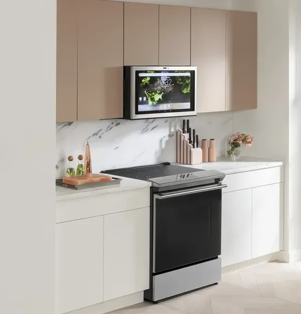 A kitchen featuring a Café range and microwave 