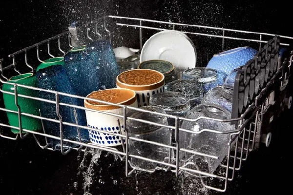 Dishes washing inside the Maytag MDTS4224PZ dishwasher 