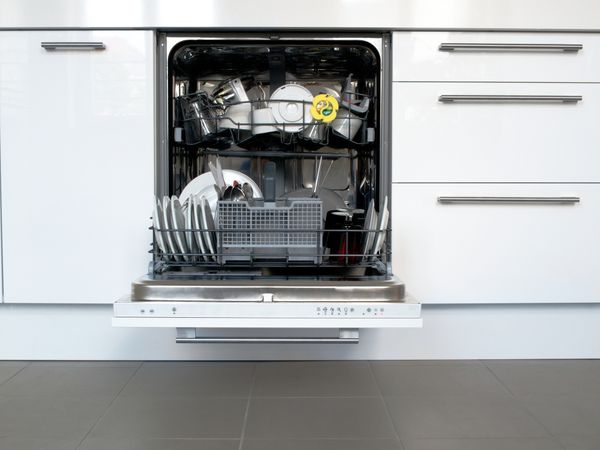 A dishwasher with its door open 