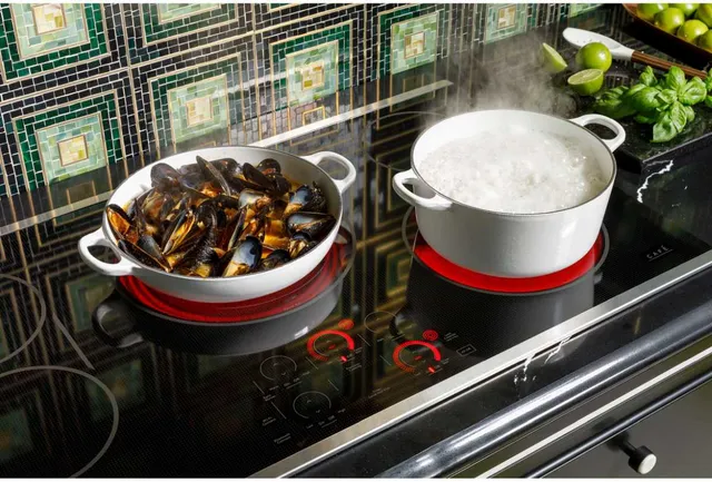 Mussels and stew cooking atop the KitchenAid CEP90301TBB electric cooktop 