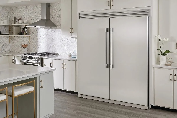 A kitchen featuring a Frigidaire Professional column refrigerator and freezer