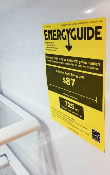 A close-up look at an EnergyGuide label inside of a refrigerator